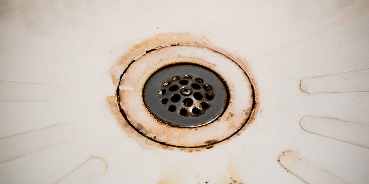 how to clean a shower drain that can't be removed