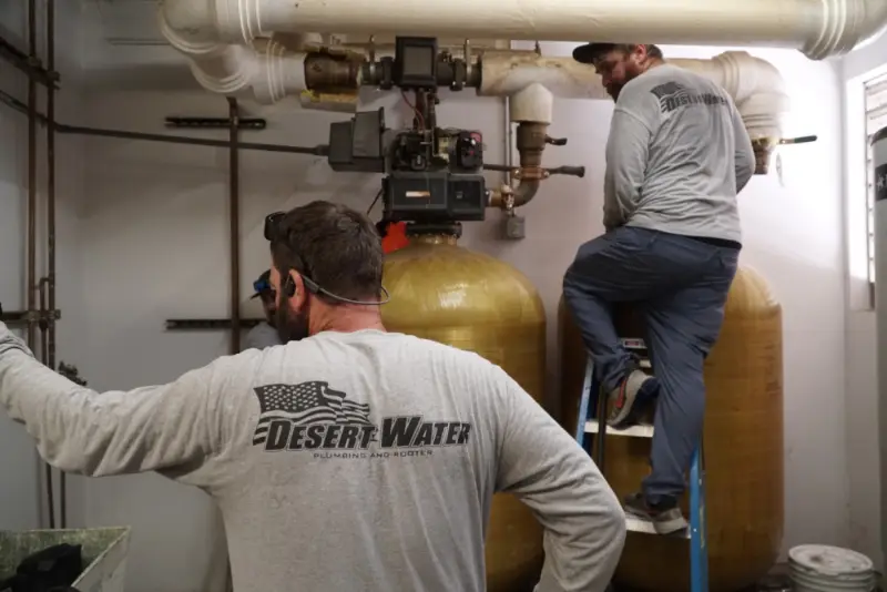 Desert Water plumbers servicing a commercial softener system