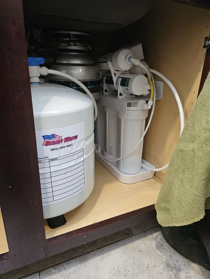 5-stage reverse osmosis system installed under a kitchen sink by Desert Water